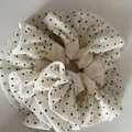Detailed view of chiffon scrunchie with classic white and black polka dot texture design - White with Black Polka Dots