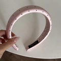 Detailed view of pink satin headband with black polka dots and quality stitching on labels - 3CM Padded / Pink Polka Dot Headband