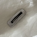 Detail of silver metal rectangular hair clip with black glossy center and beaded edges - Silver Square Style