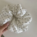 White heart print hair scrunchie with pleated fabric and elastic core in hand - White Scrunchie (Heart)