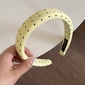 Close-up of light yellow headband with black heart pattern and non-slip inner lining - Yellow Headband (Black Heart) (3CM)