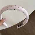 Close-up of a pink satin headband featuring black heart patterns and thick padded design - Pink Headband (Black Heart) (2CM)