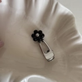 Elegant silver hair clip with a black beaded flower design on a white shell plate - Duckbill Hair Clips / Black Petals (Silver Core)