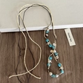 Vue détaillée du collier bohème avec étoiles de mer et perles bleues sur cordes - Perle Ronde Étoile à Cinq Branches