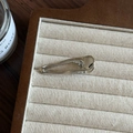 Minimalist silver metal duckbill hair clip with polished finish on a beige fabric tray - Glossy Hollow Teardrop (3#)