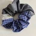 Detail of blue-gray checkered and grey fabric scrunchie with delicate white lace trim - Grey Blue Striped Stitching Scrunchie