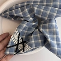 Blue and white checkered fabric scrunchie with lace trim and a small black bow accent - Blue Striped Kite Hair Tie