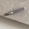 Detailed close-up of dark grey fabric hair clips with white pearls and silver accents - Grey Long Strip Hair Clip Three Pearls