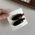 Pinzas para el pelo Hanns de acetato negro brillante con letras doradas Barrette La France - Negro Brillante Minimalista