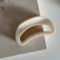Detail of a creamy white crescent hair claw clip with a glossy finish on textured linen - 19# Off-White Half Moon