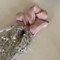 Detail of pink satin scrunchie with silver sequins and decorative printed ribbon - Pink Scrunchie Silver Sequin Streamer