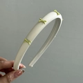 Sweet off-white leather headband with four pastel green ribbon bows for women's hair styling - Cream Yellow Headband With Yellow Bow