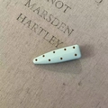 French minimalist light blue hair clip with brown polka dots on a linen background - Blue Polka Dot Teardrop Style