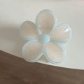 Detailed macro view of a translucent light blue jelly five-petal flower hair clip - Blue Edge White Flower