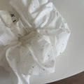 Close-up of white cotton scrunchie with silver rhinestones and woven logo label - White Rhinestone Scrunchie