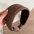 Detail of coffee brown ribbed headband with black non-slip lining and handmade label - Coffee