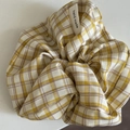 Detail of yellow plaid scrunchie featuring a white hand made fabric label on white background - 12# Yellow White Striped Cross Scrunchie