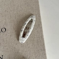 Detailed macro view of the floral fabric print and silver metal clip of the hair accessory - Cream White Floral Oval Clip