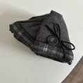 Close-up of vintage brown plaid hair claw with tweed fabric and button detail - Gray Triangle Hair Clip