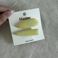 Set of two yellow hair clips with blue smiley and dashed border on white card - Yellow Triangle Hair Clip