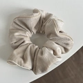Close-up of champagne beige velvet scrunchie with vertical stripes and satin edge detail - Off-white Velvet Scrunchie