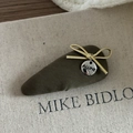 Olive green fabric hair clip with a gold rope bow and silver logo tag in Korean style - Olive Green Triangular Fabric Bow Style