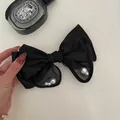 Elegant black satin and mesh bow hair clip featuring grey pearl accents for women - Mesh Bow with Artificial Pearl Hair Clip / Black