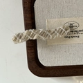 Detailed view of French vintage khaki wool knitted hairpin with white thread accents - Off-white Wavy Long Bar Style