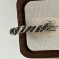 Detailed macro view of woven grey and beige wool yarn texture on a French hair clip - Grey Wavy Long Bar Style