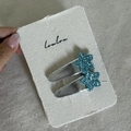 Pair of blue glitter star hair clips with silver metal bases on a white card - Silver Teardrop Blue Star Clip Pair (14#)