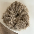Close-up of soft brown faux fur oversized scrunchie showing fluffy texture and elastic core - Coffee Plush