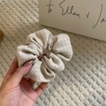 Elegant beige tweed scrunchie with silver glitter texture held in hand for hair styling - 10# White Shimmer Scrunchie