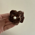 Brown corduroy flower hair clip with a centered pearl bead for elegant hair styling - Coffee