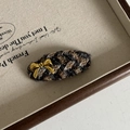 Detail of a brown houndstooth hair clip with a gold metal bow on a vintage tray - Yellow Blue Stripe Oval Hair Clip