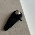 Macro shot of black textured BB hair clip with grey pearl accent on a linen background - Black PU Waterdrop Style (Pearl)