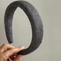 Detail view of the gray textured fabric surface on a thick sponge padded headband - Flower Headband / Gray