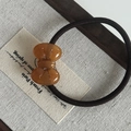 Sweet amber bow acetate hair tie with high elasticity rubber band on linen background - Tortoiseshell Bow Hair Tie