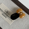 Detail of a vintage amber acetate bow hair clip with France Handmade gold lettering - Tortoiseshell Bow Black Hair Clip
