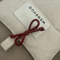 Detail of red handmade bow hair clip with France Handmade engraving on canvas - Solid Red Bow Hair Clip