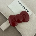 French style large red bow hair clip with glossy finish on minimalist canvas background - Large Red Bow Hair Clip