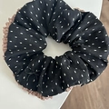 Close-up of black polka dot hair scrunchie with brown lace trim and metal bow detail - Black Bow / Black Hair Tie