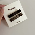 Detailed view of leopard print and dark brown hair clips on a handmade display card - Brown Leopard Duckbill Clip Style