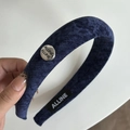Padded navy blue velvet headband featuring a vintage silver metallic charm detail - Blue Headband with Tag
