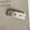Close-up of a rectangle cream corduroy hair clip with classic black polka dots pattern - White Striped Polka Dot
