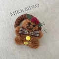 Gingerbread man plush hair scrunchie with brown bow and festive Christmas holly leaf - Gingerbread Man Striped Bow Hair Tie