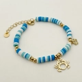 Bracelet fait main en perles d'argile bleues avec des breloques crabe dorées - Pendentif Crabe / Bleu