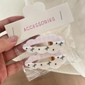 Detailed view of cloud-shaped hair clips with pink plaid and black bow patterns - Pink White Grid Black Bow