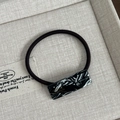 French style hair tie with black elastic band and black-white marble acetate decor piece - Black And White Marble Hair Rope