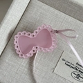 Pink ribbon bow hair clip with hollow edges and satin ribbon in minimalist style - Pink