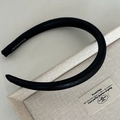 Minimalist wide black satin headband with handmade label on a beige texture box - Bright Black